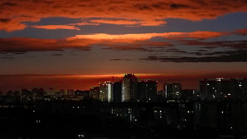 FILE PHOTO: A glow is seen over the city's skyline during a shelling, following Russia's invasion of Ukraine, in Kyiv, Ukraine February 28, 2022. 