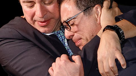 A family member embraces freed American Siamak Namazi after he and four fellow detainees were released in a prisoner swap deal between U.S and Iran, and arrived at Davison Army Airfield at Fort Belvoir, Virginia, U.S., September 19, 2023.