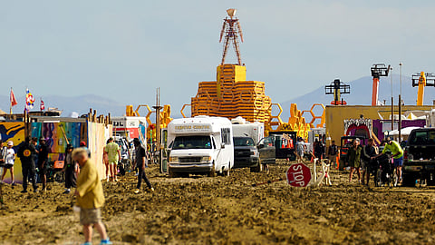 The Man structure, which is normally burned on Saturday night, looms over the Burning Man encampment after a severe rainstorm left tens of thousands of revelers attending the annual festival stranded in mud in Black Rock City, in the Nevada desert September 3, 2023. 
