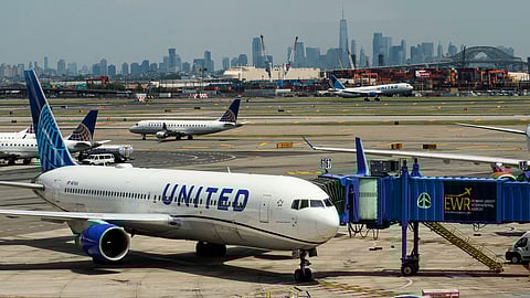 FILE PHOTO: The One World trace Center and the New York skyline are seen while United Airlines planes use the tarmac at Newark Liberty International Airport in Newark, New Jersey, U.S., May 12, 2023. 