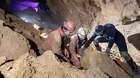 Rescuers try to move a rock in Morca Cave, as they take part in a rescue operation to reach U.S. caver Mark Dickey who fell ill and became trapped some 1,000 meters (3,280 ft) underground, near Anamur in Mersin province, southern Turkey September 5, 2023. 