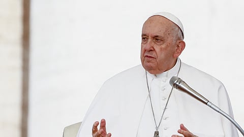 Pope Francis delivers his blessing during the weekly general audience in Saint Peter's Square at the Vatican, October 18, 2023. 