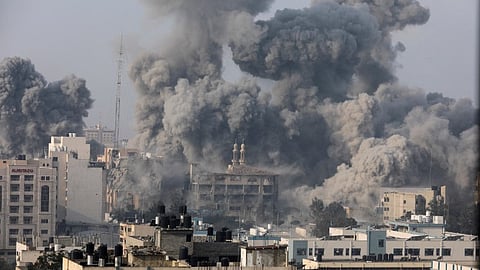 Smoke billows following Israeli strikes in Gaza City, October 11, 2023. 