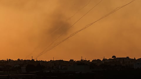 Rockets are launched from the Gaza Strip towards Israel, as seen from near Israel's border with Gaza in southern Israel, October 12, 2023. 