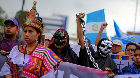 People take part in a protest to demand the resignation of powerful senior prosecutors accused of working to undermine President-elect Bernardo Arevalo's ability to take office, in Guatemala City, Guatemala October 7, 2023. 
