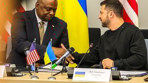 U.S. Secretary of Defense Lloyd Austin III shakes hands with Ukraine's President Volodymyr Zelenskiy during meeting of Ukraine Defense Contact Group ahead of a two day NATO Defense Ministers Council at the alliance headquarters in Brussels, Belgium, October 11, 2023. 
