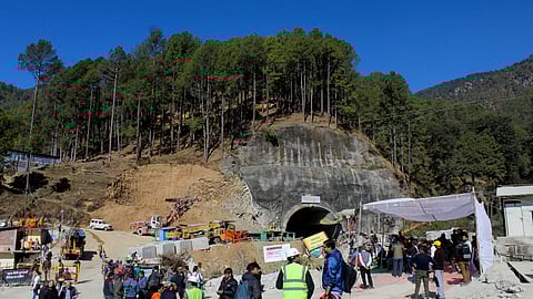 FILE PHOTO: Media personnel and onlookers gather near the entrance of a tunnel under construction where workers are trapped following a collapse, in Uttarkashi, in the northern state of Uttarakhand, India, November 24, 2023. 