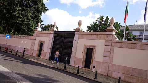 A woman passes the entrance of Portugal Prime Minister official redidence in Sao Bento Palace, Lisbon, Portugal, November 7, 2023. 