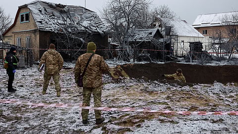 Police officers inspect a site of a Russian missile strike, amid Russia's attack on Ukraine, in Kyiv, Ukraine December 11, 2023. 