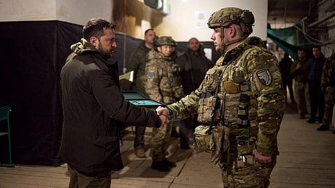 FILE PHOTO: Ukraine's President Volodymyr Zelenskiy awards a Ukrainian serviceman at a position in the town of Kupiansk, amid Russia's attack on Ukraine, in Kharkiv region, Ukraine November 30, 2023. 