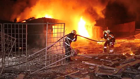 Emergency personnel work to put out a fire following a drone attack, amid Russia's attack on Ukraine, in Kharkiv, Ukraine in this screengrab obtained from a video released on January 31, 2024. 