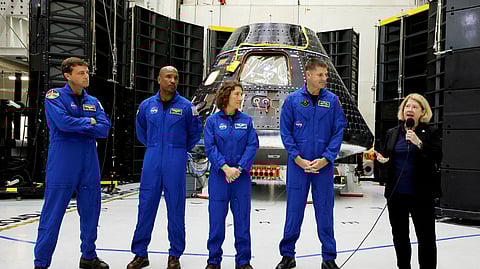 FILE PHOTO: Astronauts for NASA's Artemis II mission stand in front of their Orion crew capsule, expected to carry Reid Wiseman, commander, Victor Glover, pilot, and mission specialists Christina Hammock Koch and Jeremy Hansen, with the Canadian Space Agency, as NASA Deputy Administrator Pam Melroy speaks at a press conference at the Kennedy Space Center in Cape Canaveral, Florida, U.S., August 8, 2023. 

