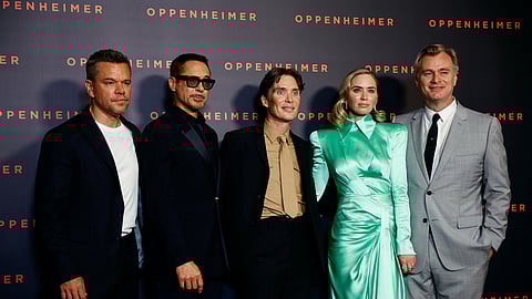 Director Christopher Nolan, cast members Matt Damon, Robert Downey Jr., Cillian Murphy and Emily Blunt pose during a photocall before the premiere of the film "Oppenheimer" at the Grand Rex in Paris, France, July 11, 2023. 

