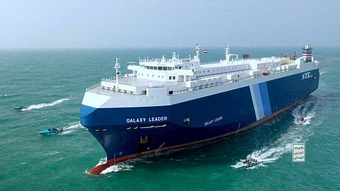 FILE PHOTO: The Galaxy Leader cargo ship is escorted by Houthi boats in the Red Sea in this photo released November 20, 2023. 
