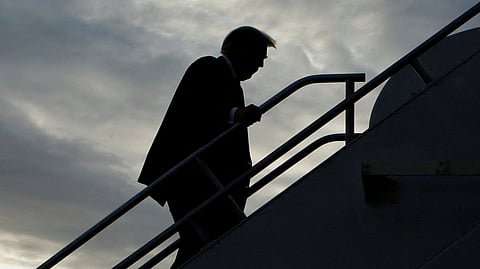 FILE PHOTO: Former U.S. President and Republican presidential candidate Donald Trump boards his plane to depart from Eastern Iowa Airport after campaigning in Cedar Rapids, Iowa, U.S. October 7, 2023. 