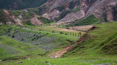 A view shows constructions in a mountainous area near the town of Mailuu-Suu in the Jalal-Abad region, Kyrgyzstan, April 20, 2024. Dams holding vast amounts of uranium mine tailings above the fertile Fergana valley in Central Asia are unstable, threatening a possible Chernobyl-scale nuclear disaster if they collapse that would make the region uninhabitable, studies have revealed. 

