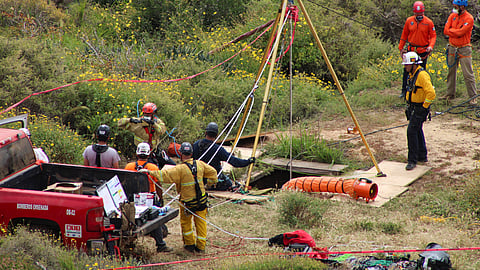 Members of a rescue team work at a site where three bodies were found in the state of Baja California where one American and two Australian tourists were reported missing, in La Bocana, Mexico May 3, 2024. 