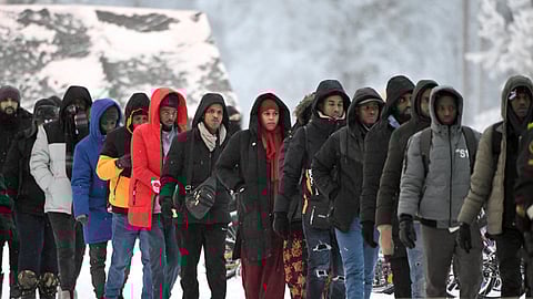 FILE PHOTO: Group of migrants arrive to the international border crossing at Salla, northern Finland, November 23, 2023. 
