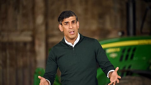 FILE PHOTO: British Prime Minister Rishi Sunak speaks to farmers as he campaigns on a farm near Barnstaple in North Devon, Britain, June 18, 2024. 