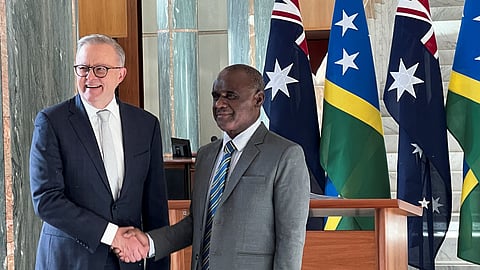 Solomon Islands Prime Minister Jeremiah Manele shakes hands with Australia Prime Minister Anthony Albanese in Australia’s national parliament, on his first visit to Australia since winning a national election, in Canberra, Australia, June 26, 2024. 