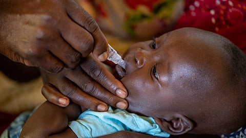 FILE PHOTO: A child receives an oral Malaria vaccine at Chileka Health Center, in Lilongwe, Malawi in this undated handout photo. 

