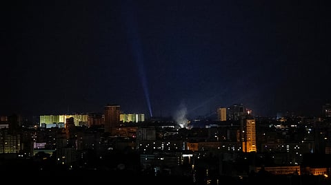 Ukrainian servicemen use searchlights as they look for drones in the sky over the city during a Russian drone strike, amid Russia's attack on Ukraine, in Kyiv, Ukraine July 21, 2024. 
