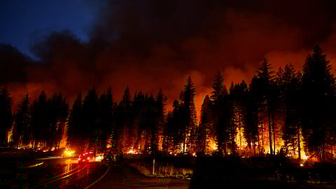 Smoke fills the sky as firefighters work to control the Park Fire along Highway 32, near Jonesville, California, U.S., July 28, 2024. 

