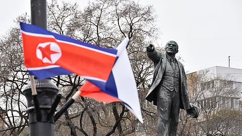 FILE PHOTO: State flags of Russia and North Korea fly in a street near a monument to Soviet state founder Vladimir Lenin during the visit of North Korea's leader Kim Jong Un to Vladivostok, Russia April 25, 2019. 
