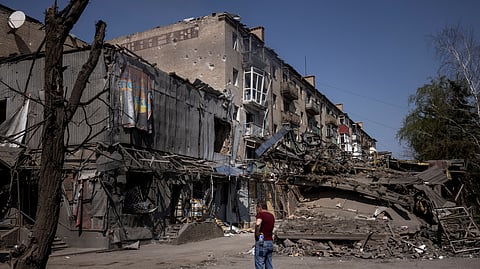 FILE PHOTO: A man looks at the damage from shelling opposite the train station in Kostiantynivka, amid Russia's attack on Ukraine, April 10, 2024. 