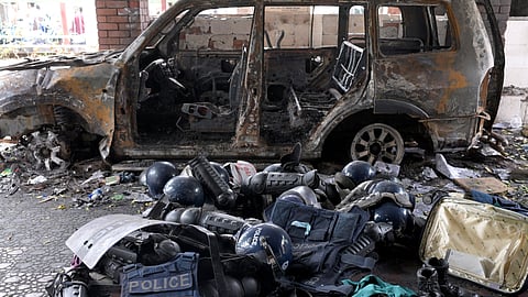 FILE PHOTO: Damaged riot gear of security forces is seen next to a burnt vehicle outside a police station, days after the resignation of former Bangladeshi Prime Minister Sheikh Hasina, in Dhaka, Bangladesh, August 8, 2024. 
