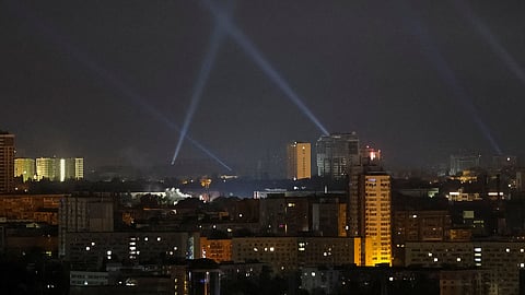 Ukrainian service personnel use searchlights as they search for drones in the sky over the city during a Russian drone strike, amid Russia's attack on Ukraine, in Kyiv, Ukraine August 29, 2024. 
