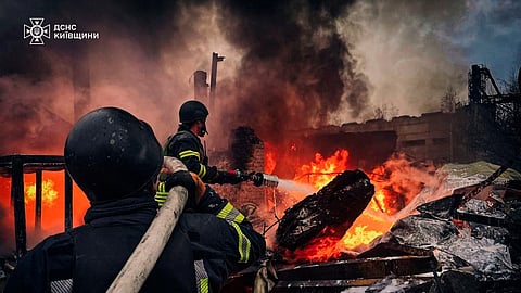 Firefighters work at the site where an industrial area was hit by a Russian missile strike, amid Russia’s attack on Ukraine, in Kyiv region, Ukraine November 13, 2024. 