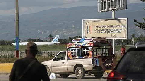 FILE PHOTO: A person walks outside Toussaint Louverture International Airport after airlines suspended flights, in Port-au-Prince, Haiti October 25, 2024. 