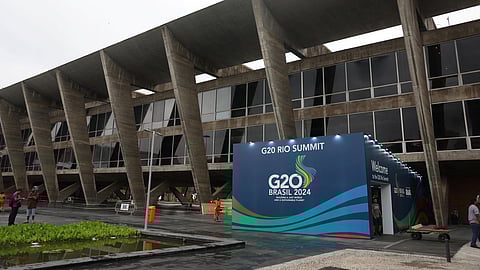 People work outside the Museum of Modern Art (MAM), venue of the G20 summit, in Rio de Janeiro, Brazil November 13, 2024. 