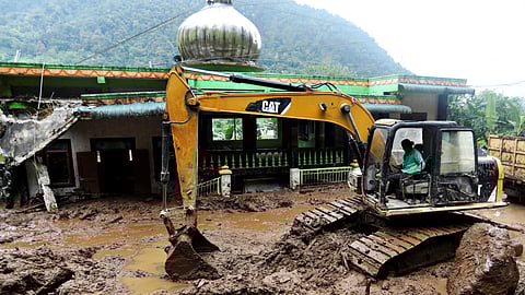 FILE PHOTO: An excavator moves soil during the search and rescue of victims on the site of a landslide caused by heavy rain at Semangat Gunung Village in Karo, North Sumatra province, Indonesia, November 25, 2024. 