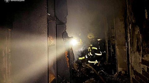 Firefighters work at the site of an apartment building hit by a Russian drone strike, amid Russia's attack on Ukraine, in Ternopil, Ukraine December 2, 2024. 
