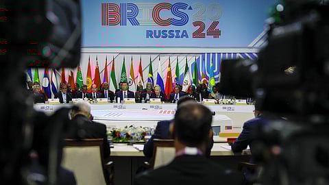 FILE PHOTO: Officials, including Russian President Vladimir Putin, Chinese President Xi Jinping and Egyptian President Abdel Fattah al-Sisi, are seen through television cameras during a plenary session in the outreach/BRICS Plus format at the BRICS summit in Kazan, Russia October 24, 2024. 
