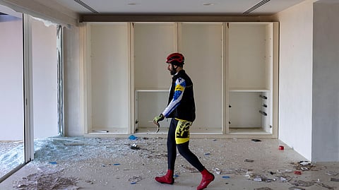 Cyclist Bassel Soufi visits the summer resort of ousted Syria's Bashar al-Assad as he tours a part of his daily training in Burj Islam near Latakia, Syria, December 13, 2024. 