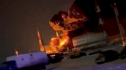 Smoke and fire rise from an infrastructure facility storing fuel, following what regional governor Andrei Klychkov called a Ukrainian drone attack, in Oryol, Russia, in this screengrab obtained from social media video released on December 14, 2024. 