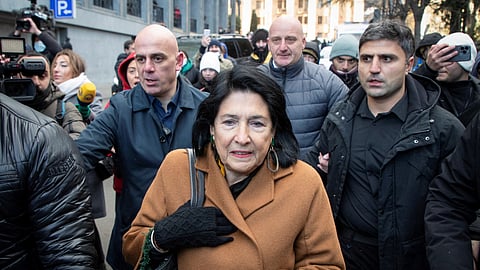 Georgia's President Salome Zourabichvili walks outside the parliament building as deputies vote to elect a new president, in Tbilisi, Georgia December 14, 2024. 