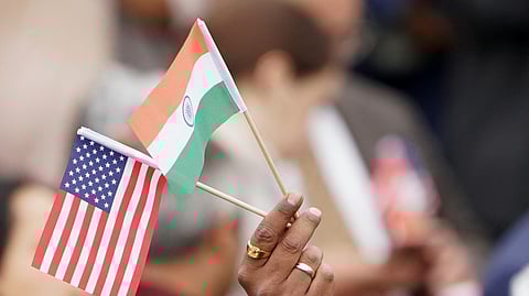 FILE PHOTO: An attendee holds U.S. and India's flags as they gather on the South Lawn of the White House to watch an official State Arrival ceremony as U.S. President Joe Biden hosts India's Prime Minister Narendra Modi for a State Visit at the White House in Washington, U.S., June 22, 2023. 