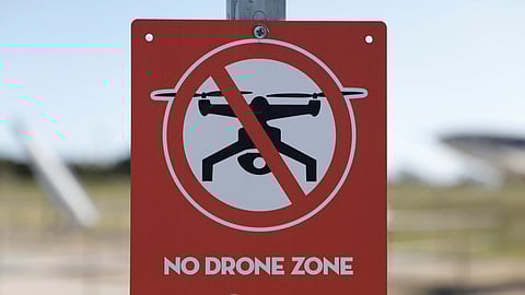 FILE PHOTO: A Federal Aviation Administration (FAA) sign warns against the use of drones, in this illustration. 