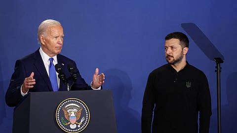 FILE PHOTO: Ukraine's President Volodymyr Zelenskiy listens to U.S. President Joe Biden speak at a Ukraine Compact meeting, on the sidelines of the NATO's 75th anniversary summit in Washington, U.S. July 11, 2024. 