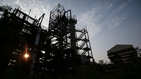 FILE PHOTO: The sun sets behind the abandoned former Union Carbide pesticide plant in Bhopal November 11, 2014. 
