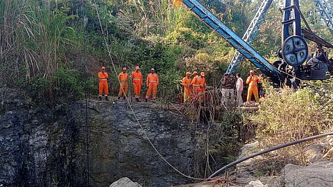 Members of a rescue team stand next to a pulley machine during a rescue operation for trapped miners in Umrangso in Dima Hasao district in the northeastern state of Assam, India, January 7, 2025.