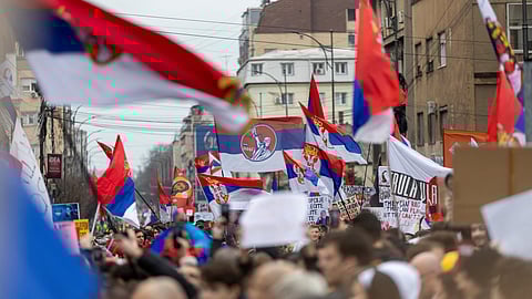 Students and opposition supporters wave with flags during a protest over the fatal November 2024 Novi Sad railway station roof collapse, in Nis, Serbia March 1, 2025. 