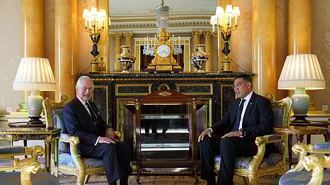 FILE PHOTO: King Charles III speaks with Prime Minister of Jamaica, Andrew Holness, as he receives realm prime ministers in the 1844 Room at Buckingham Palace in London. Picture date: Saturday September 17, 2022. 