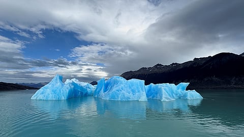 FILE PHOTO: A block of ice melts in the Lago Argentino (Argentine Lake), in the Parque Nacional Los Glaciares, near the city of El Calafate in the Patagonian province of Santa Cruz, Argentina April 22, 2025. 