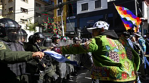 Police officers clash with demonstrators during a protest march by supporters of former Bolivian president Evo Morales after he was blocked by Bolivia's constitutional court from running in the presidential election this year, in La Paz, Bolivia May 16, 2025. 