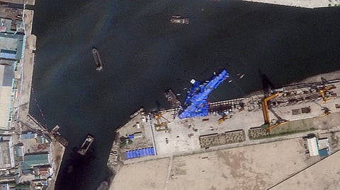 A satellite image shows a North Korean warship covered with a blue tarp after an accident that occurred during its launch at the shipyard in Chongjin, North Korea, May 23, 2025. 
